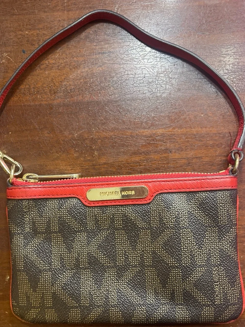 Michael Kors Brown Monogram Wristlet with Red Trim